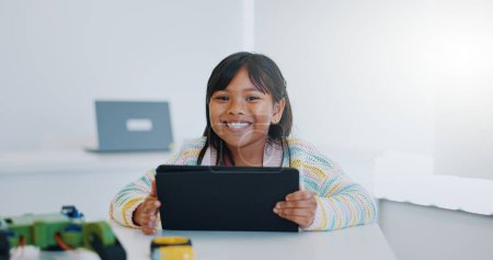 Photo for Smile, portrait and child in classroom with tablet, education and learning science with website. School, internet and face of happy girl with digital app for robotics, online research and technology - Royalty Free Image