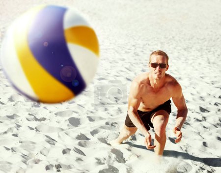 Photo for Beach, volleyball and top view of fitness man at sea with ball, energy or travel freedom. Ocean, sport or top view of male player with handball in nature for cardio, workout or game performance. - Royalty Free Image