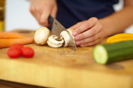 Photo for Chef hands, knife and vegetables on chopping board, cooking and preparation at home. Closeup of woman cutting mushrooms in kitchen, organic salad and food for healthy vegan diet, nutrition and dinner. - Royalty Free Image