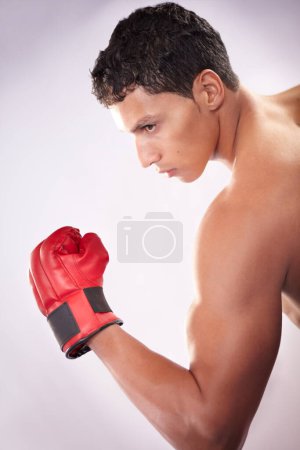 Photo for Man, fighter or gloves white background for boxing strength, sports training or active martial arts. Male person, shirtless or punch arm fist performance for competition, commitment or mma in studio. - Royalty Free Image
