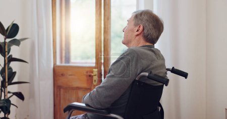 Photo for Wheelchair, thinking and senior man patient in retirement home with mental health and grief. Bedroom, sad and elderly male person with disability at window with memory, lonely and dream in a house. - Royalty Free Image
