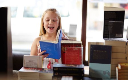 Photo for Smile, stack of books and child in bookshop, learning and relax, studying homework knowledge in store. School, happiness and girl reading in bookstore with story, fantasy and education in shop window. - Royalty Free Image