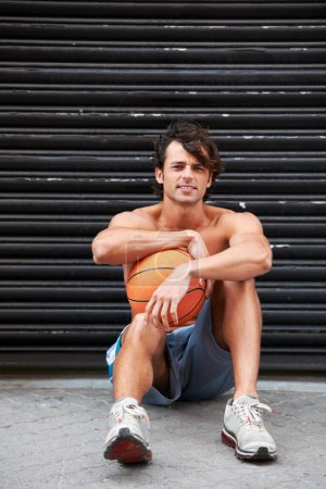 Photo for Basketball player, portrait or sports man relax, break and wellness after workout performance, exercise or practice. Active, athlete or urban person rest after fitness, shirtless and sitting on floor. - Royalty Free Image