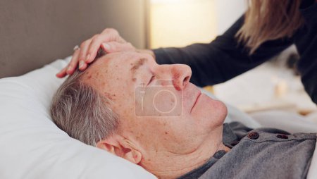 Photo for Senior woman caring her husband in bed with love, care and marriage at modern home together. Sick, recover and elderly couple in retirement with illness in bedroom of hospice, nursing center or house. - Royalty Free Image