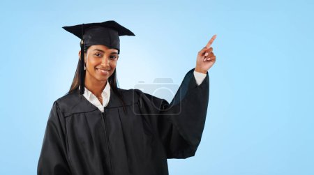 Photo for Graduate student, portrait or happy woman point at school direction, university ads or college learning, knowledge or academy. Mockup space, graduation studio or education decision on blue background. - Royalty Free Image