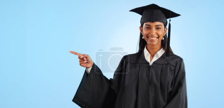 Photo for Graduate, studio portrait or happy woman point at school registration, university ads or college information, choice or academy. Mockup space, education and graduation notification on blue background. - Royalty Free Image