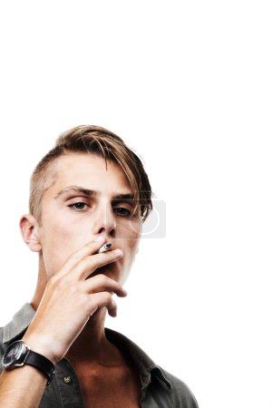 Photo for Portrait, mockup or man smoking a cigarette for stress, toxic addiction or unhealthy habit to relax. Dangerous, smoker or male person in Germany to inhale tobacco on white background or studio space. - Royalty Free Image