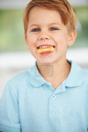 Photo for Child, portrait or orange slice fruit or mouth health snack, vitamin c or raw food youth development. Boy, kid or face fresh smile diet or organic citrus nutrition, fibre breakfast or morning mineral. - Royalty Free Image