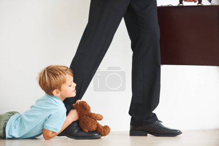 Photo for Sad, child and businessman to leave for work, tantrum and closeup with anxiety, stress or mental health. Father, kid or begging on floor to stop dad, corporate worker and professional accountant. - Royalty Free Image
