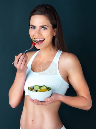 Photo for Salad, woman and eating portrait with fitness, health and nutrition of meal with a smile in studio. Workout, happy and female model with exercise and training with healthy diet food and vegetables. - Royalty Free Image