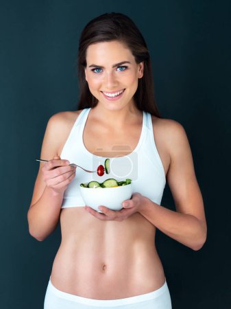 Photo for Salad, woman and sport portrait with fitness, health and nutrition of meal with a smile in studio. Workout, happy and female model with exercise and training with healthy food and vegetables for care. - Royalty Free Image