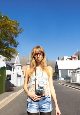 Photo for Travel, photography and portrait of woman with camera for creative and art career in the city. Glasses, gen z and young female person from Australia with dslr equipment on weekend trip in town - Royalty Free Image