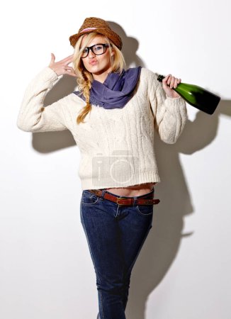 Photo for Champagne, drunk or portrait of woman in studio for a fun celebration, party or adult event. Face, hand gun or wild person drinking alcohol or beverage in bottle for New Year on white background. - Royalty Free Image