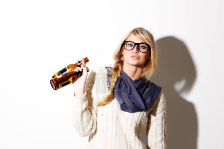 Photo for Portrait, beer and a glass bottle with a woman drinking in studio on a mockup white background. Party, event or alcohol with a young drunk girl enjoying a beverage for celebration or to relax. - Royalty Free Image