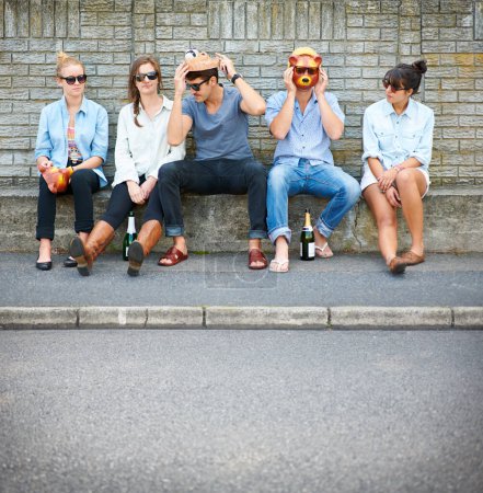 Photo for Party, friends and people with animal mask for fashion, bond and drink alcohol in city. Group, sunglasses and dress up in street, stylish men and hipster women sitting outdoor together for Halloween. - Royalty Free Image