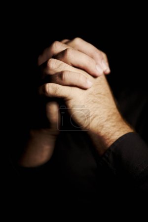Photo for Praying, hands and black background for faith, hope and religion or asking for help with mental health or support in studio. Prayer emoji, christian person and sorry, forgive or humanity in dark room. - Royalty Free Image