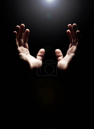 Photo for Hands, prayer and help from God with praise, closeup of holy person with gratitude and respect for religion. Guide, wellness and praying, worship and faith with hope and trust on dark background. - Royalty Free Image