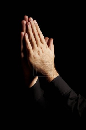 Photo for Prayer, hands and black background for hope, religion and faith or ask for help with worship or spiritual support in studio. Praying emoji, christian person and God, forgive or humanity in dark room. - Royalty Free Image
