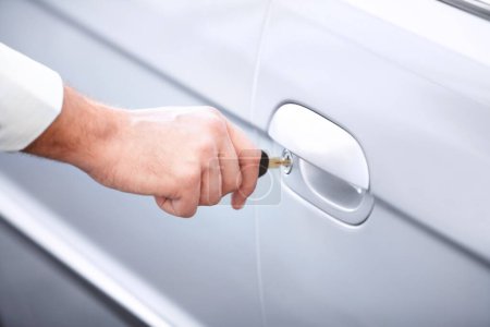 Photo for Closeup, hand and keys to a car for opening a door, travel or transportation. Zoom, salesman and a person at transport, vehicle or a rental for. commute, trip or journey in the morning in town. - Royalty Free Image