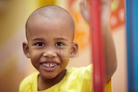 Photo for African boy, portrait and smile in classroom at kindergarten with pride for development, scholarship or learning. Child, student and face at school, happy and education for future, growth or academy. - Royalty Free Image