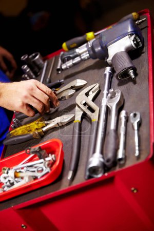 Photo for Hands, mechanic and toolbox for auto service at workshop, small business or garage. Closeup, man and equipment, toolkit or metal tools of technician, engineer or expert for repair, maintenance or fix. - Royalty Free Image