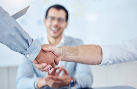 Photo for A partner that gets you there. two unrecognizable businesspeople shaking hands in a modern office - Royalty Free Image