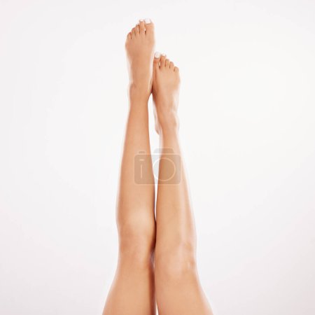 Photo for Its pamper time. a woman showing off her legs against a grey background - Royalty Free Image