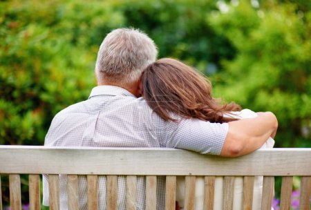 Photo for Park, back view or mature couple on bench for support, trust or hope in commitment together in nature. Hug, garden or senior man bonding to relax with woman on anniversary for love, wellness or care. - Royalty Free Image