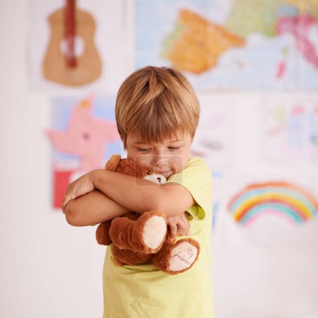 Photo for Theres no comfort quite like a favorite teddy. a cute little boy hugging his teddybear - Royalty Free Image