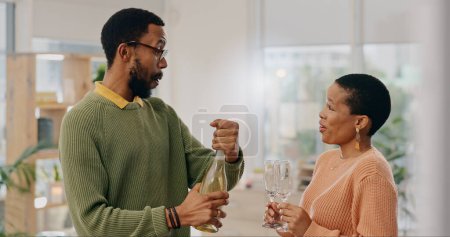 Photo for Champagne bottle, drinks glass and black couple celebrate marriage union, anniversary date or honeymoon. Romantic partner, home wine and African man, woman or people with liquid alcohol beverage. - Royalty Free Image
