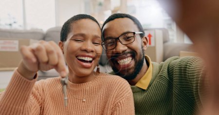 Photo for Black couple, portrait and a selfie with keys in a new home after moving and relocation. Smile, showing and an African man and woman excited with a photo for ownership or buying of a house together. - Royalty Free Image