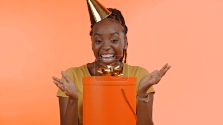 Photo for Birthday, surprise and black woman with present, box or gift in studio background or celebration. Wow, congratulations and excited winner of giveaway, package or product on offer for party and event. - Royalty Free Image
