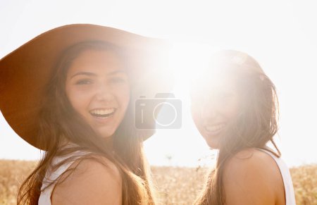 Photo for Our tans may fade but these memories will last forever. Two beautiful young friends spending time together in the sunshine - Royalty Free Image