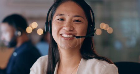 Photo for Business woman, portrait and call center, night communication or consultant support for customer service. Happy, face and professional agent or asian advisor for solution, help desk and virtual chat. - Royalty Free Image