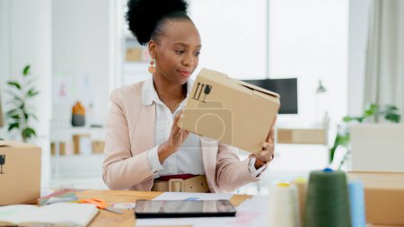 Photo for Black woman, box and logistics in small business, supply chain or schedule delivery at boutique store. African female person or entrepreneur with parcel, package or cargo for shipping at retail shop. - Royalty Free Image