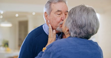 Photo for Care, love or old couple kiss in home to relax for connection, support, bond for trust or comfort. Elderly people in marriage, house or retirement with commitment, affection or romance together. - Royalty Free Image