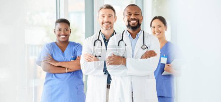 Photo for Lets start this day the way we always do. a group of medical practitioners standing together in a hospital - Royalty Free Image