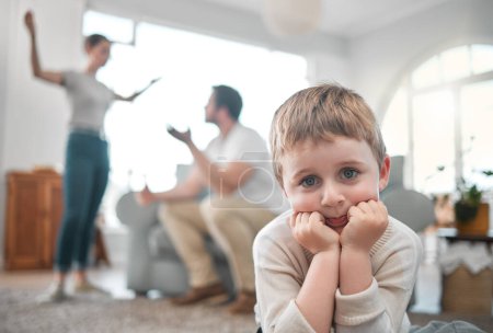 Photo for Adults are just outdated children. a little boy looking sad while his parent argue at home - Royalty Free Image