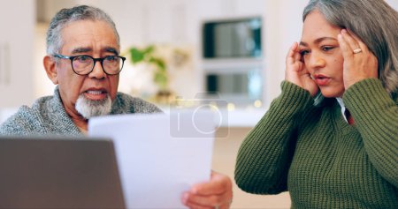 Photo for Senior couple, stress and documents for tax, debt and bills, bankruptcy or retirement. Elderly man, woman and paperwork in financial crisis, planning budget or asset management in living room at home. - Royalty Free Image