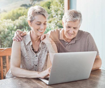 Photo for Im curious to see what you want to show me. a mature couple using a laptop while sitting outside - Royalty Free Image