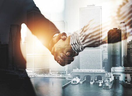 Photo for Congratulations on your outstanding achievements. Closeup shot of two unrecognizable businesspeople shaking hands in an office - Royalty Free Image