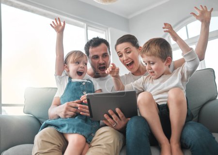 Photo for We appreciate every visit. a young family using a digital tablet at home - Royalty Free Image