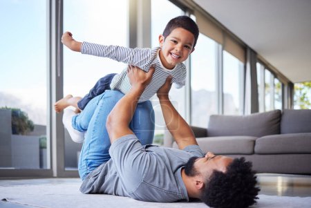 Photo for Every day is fun with dad. a young father playing with his son at home - Royalty Free Image
