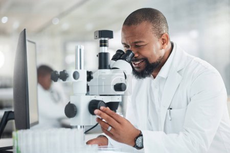 Photo for New samples have come in for the case study at hand. a mature man using a microscope in a lab - Royalty Free Image