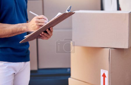 Photo for If you make a sale, you can make a living. a unrecognizable man using a clipboard while delivering outside - Royalty Free Image