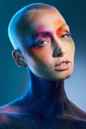 Photo for Create your own beautiful world. Studio shot of a young woman posing with multi-coloured paint on her face - Royalty Free Image