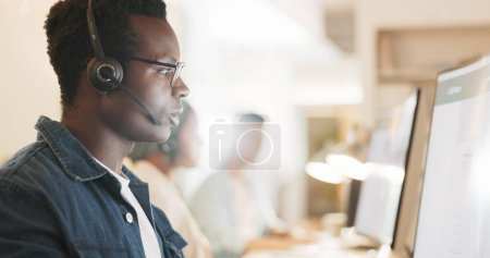 Photo for Call center, consulting and online with black man in office for contact us, communication and customer support. Salesman, help desk and technical support with person in crm agency for telemarketing. - Royalty Free Image