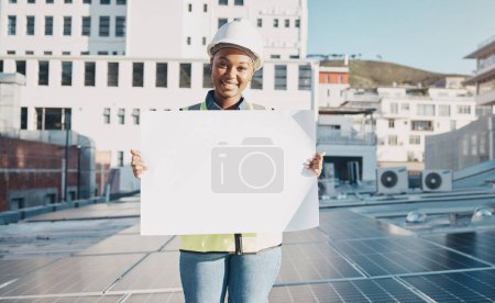 Photo for Black woman, architect and billboard on solar panel roof for advertising or construction plan in the city. Portrait of happy African female person, engineer or contractor holding sign, paper or board. - Royalty Free Image