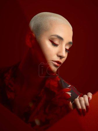 Photo for Woman, beauty and red aesthetic with fashion and art deco, makeup and shine isolated on studio background. Female model, skin glow with bold cosmetics, young female model with glamour and creative. - Royalty Free Image