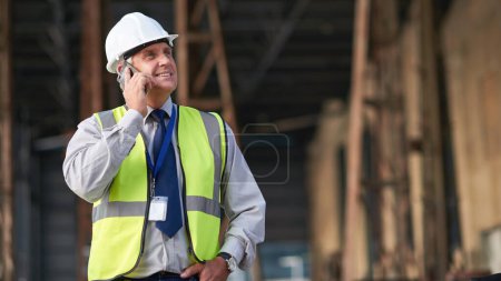 Photo for Engineer, construction and phone of a man outdoor for building project management. Senior contractor person talking to contact for civil engineering, safety idea and development at mockup space site. - Royalty Free Image